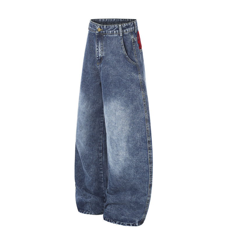 Jean homme wide leg délavé à l'acide avec broderie rouge en écriture manuscrite