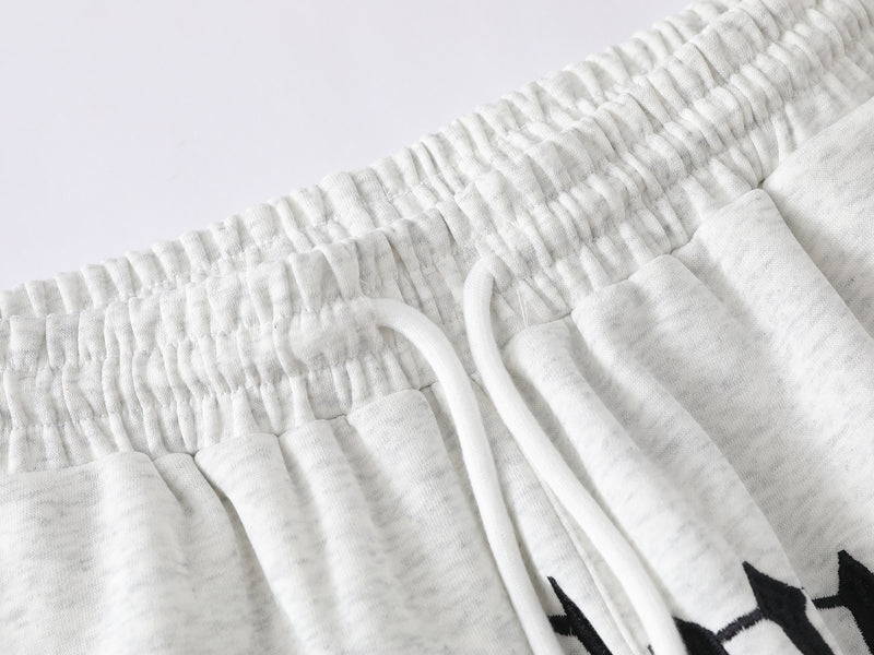 Pantalon de survêtement à jambes larges avec imprimé gothique « Welcome » et deux pistolets – Style streetwear hip-hop