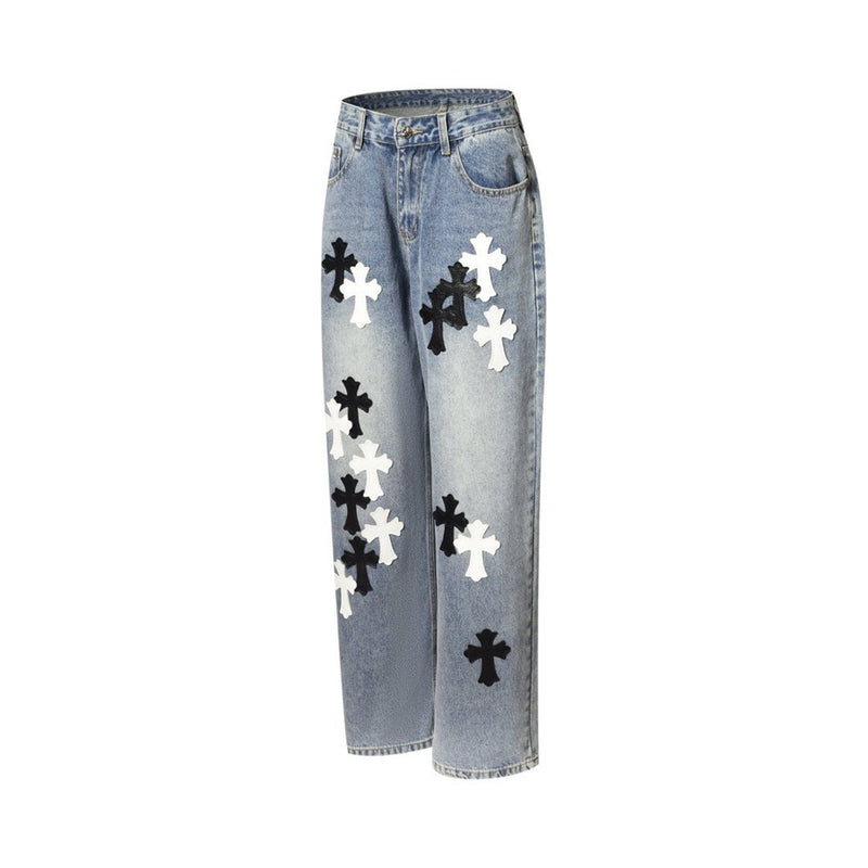 Light wash wide-leg jeans with cross patches, side view