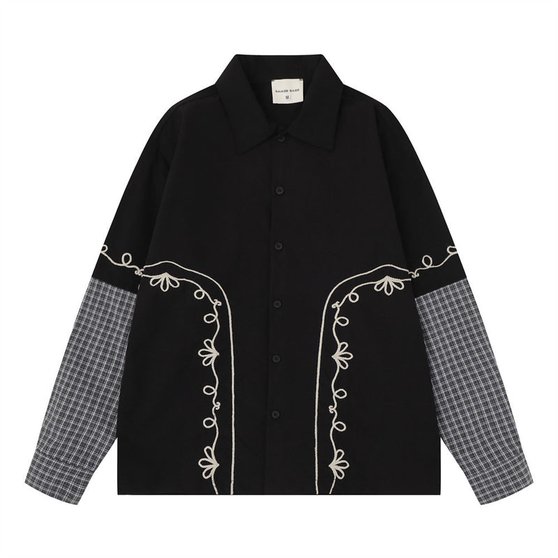 Oversized embroidered patchwork long sleeve shirt with grey plaid contrast sleeves and floral vine embroidery on chest, shown