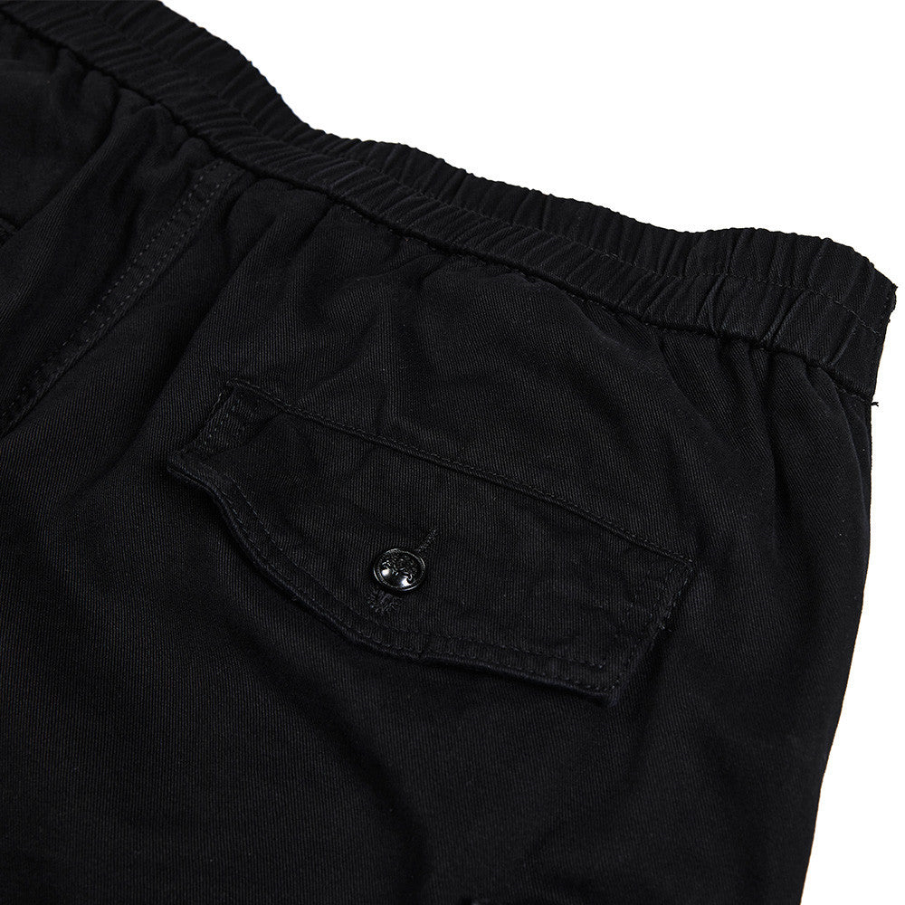 Pantalon cargo homme noir wide leg avec taille effet double boutonnage et multiples poches