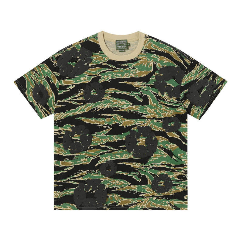 Denim Tears green tiger stripe camouflage all-over print cotton T-shirt with beige ribbed crew neck, laid flat on white background