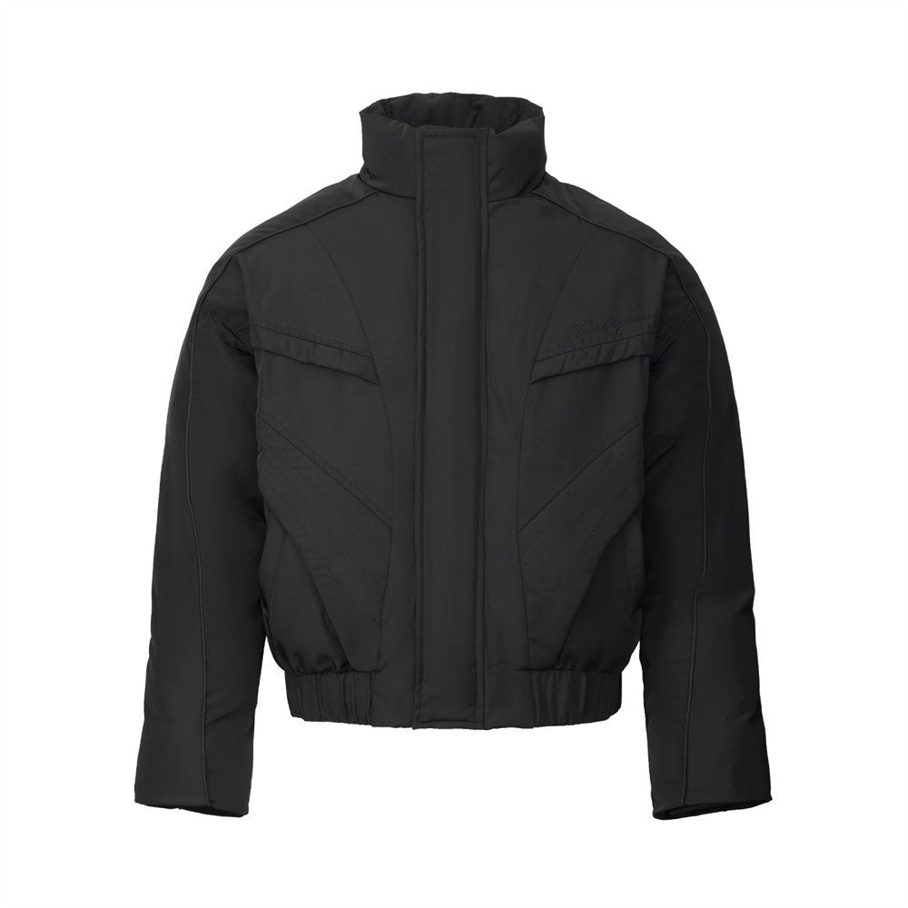Oversized puffer bomber jacket with stand collar and geometric seam detail in black and off-white