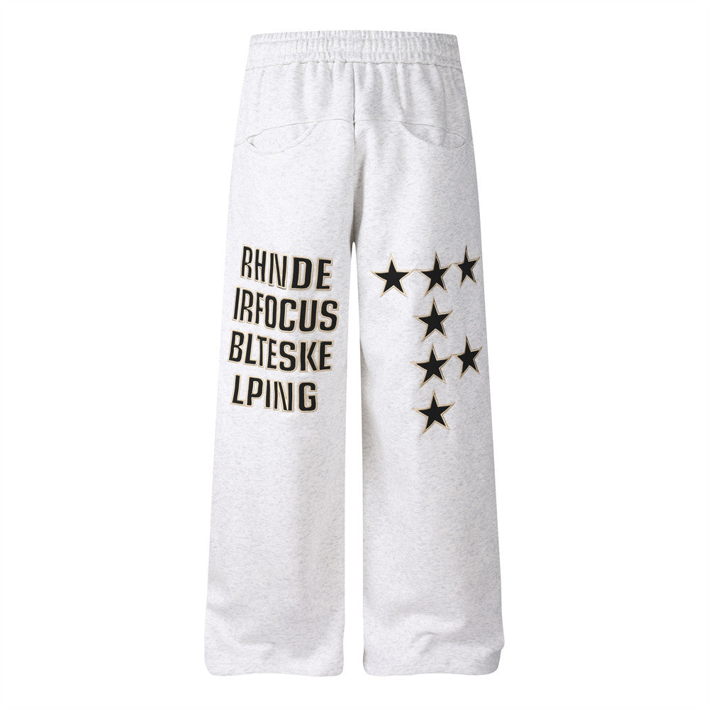 Pantalon de survêtement homme coupe wide leg – Étoiles, lettrage et cordon plissé
