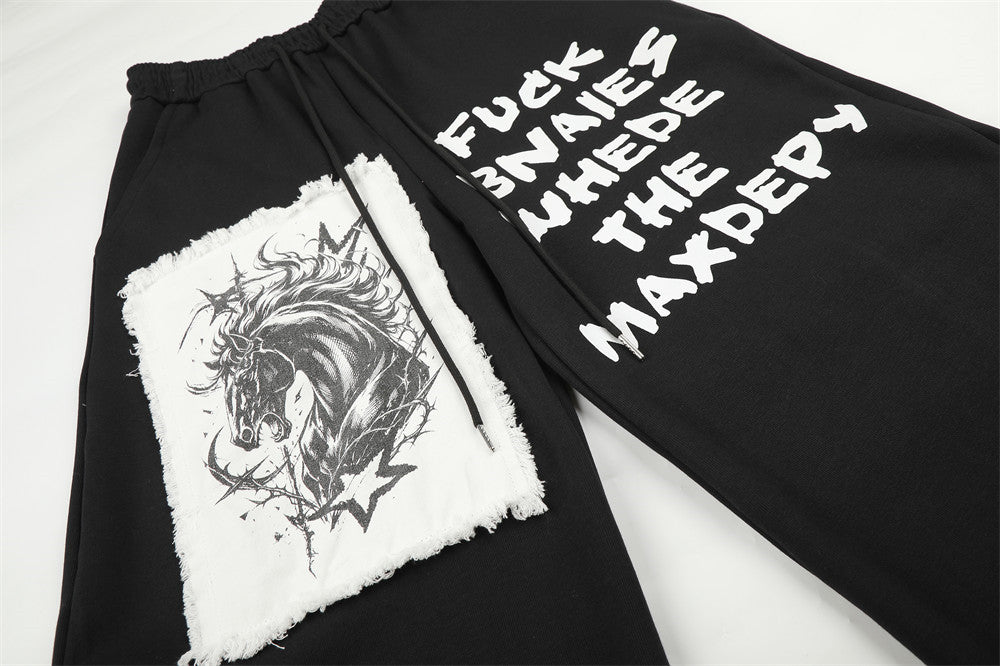 Pantalon de survêtement homme à jambes larges, motif graphique – Écusson licorne et slogan imprimé noir