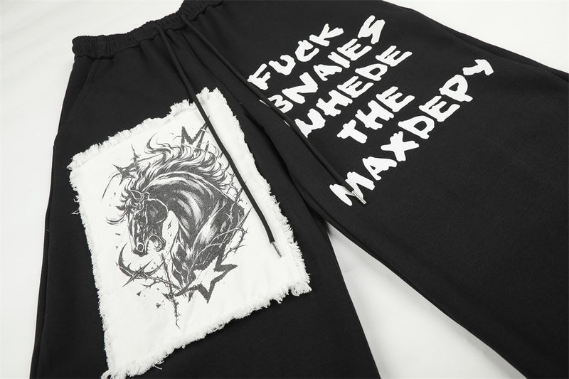 Pantalon de survêtement homme à jambes larges, motif graphique – Écusson licorne et slogan imprimé noir