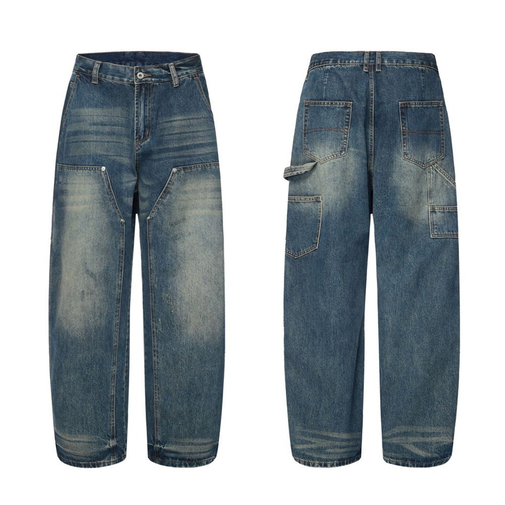 Men's baggy vintage-washed carpenter jeans in medium blue with wide-leg silhouette and V-yoke front seam, front and back view