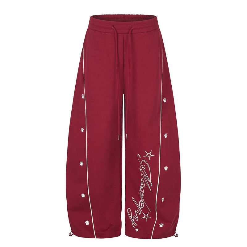 Pantalon de jogging large – Motif patte et coutures courbes rouges