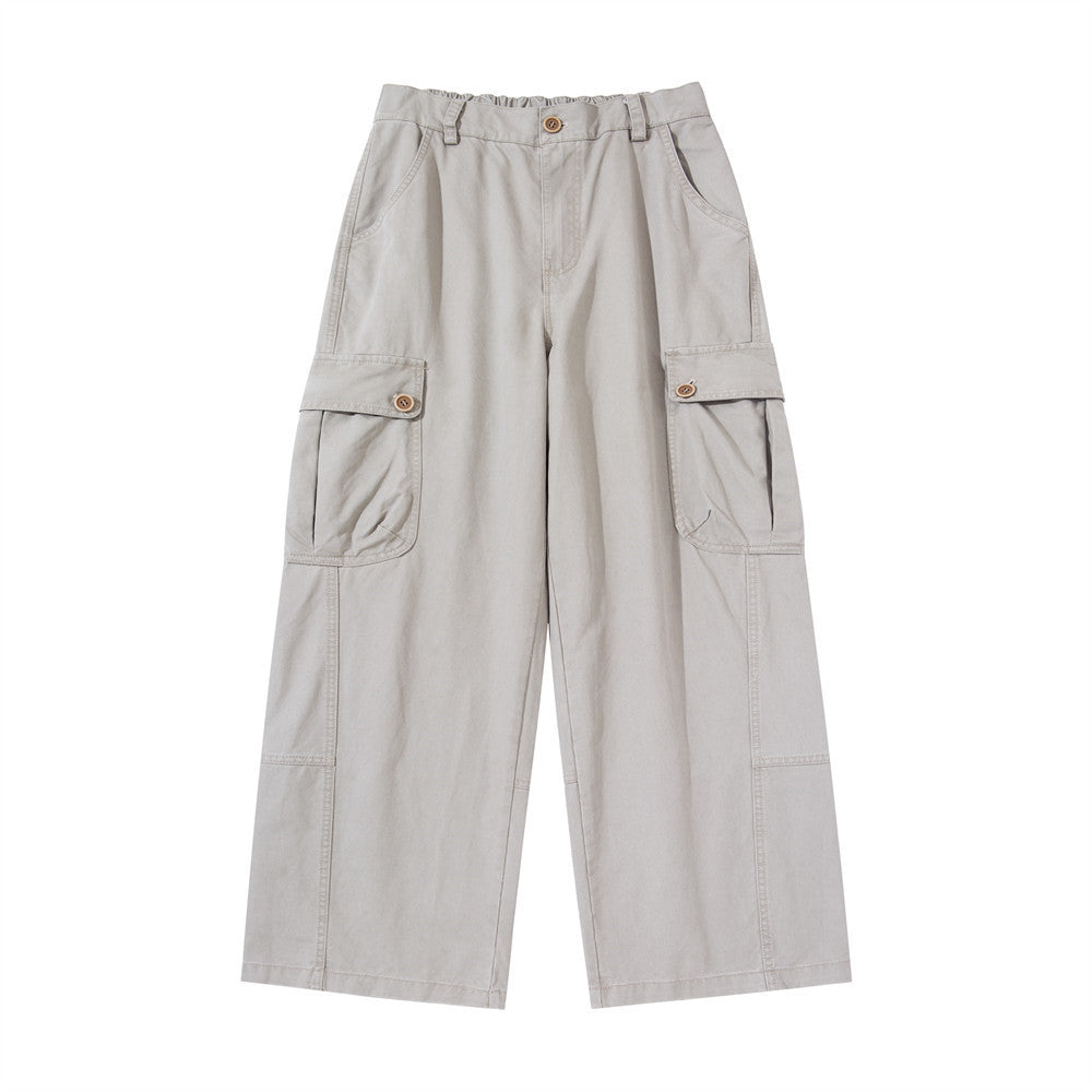 Wide-leg men's cargo pants in light grey with large buttoned thigh pockets and elasticated waistband