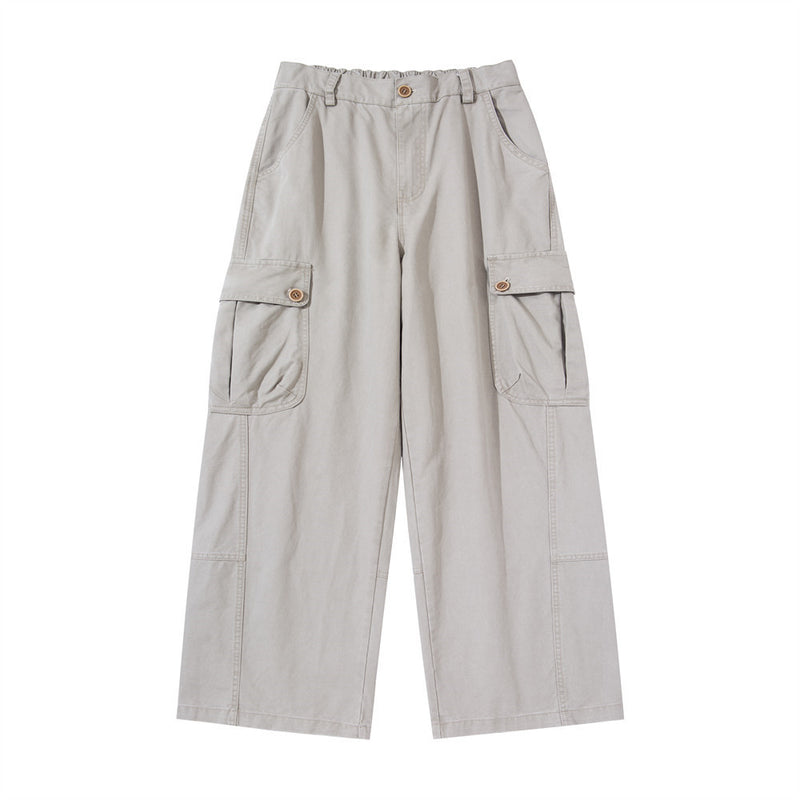 Wide-leg men's cargo pants in light grey with large buttoned thigh pockets and elasticated waistband