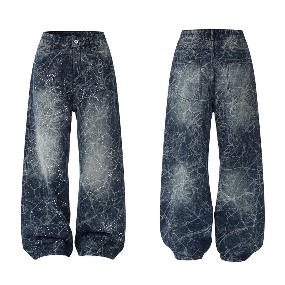 Wide-leg distressed indigo jeans with rhinestone constellation detailing and all-over spider-web vintage wash, front and back