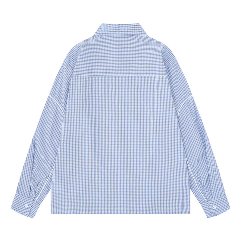 Light blue plaid long sleeve shirt shown from the back, oversized fit with contrast piping