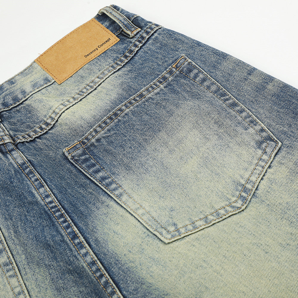 Jean homme coupe large – Denim délavé effet usé avec clous pyramidaux