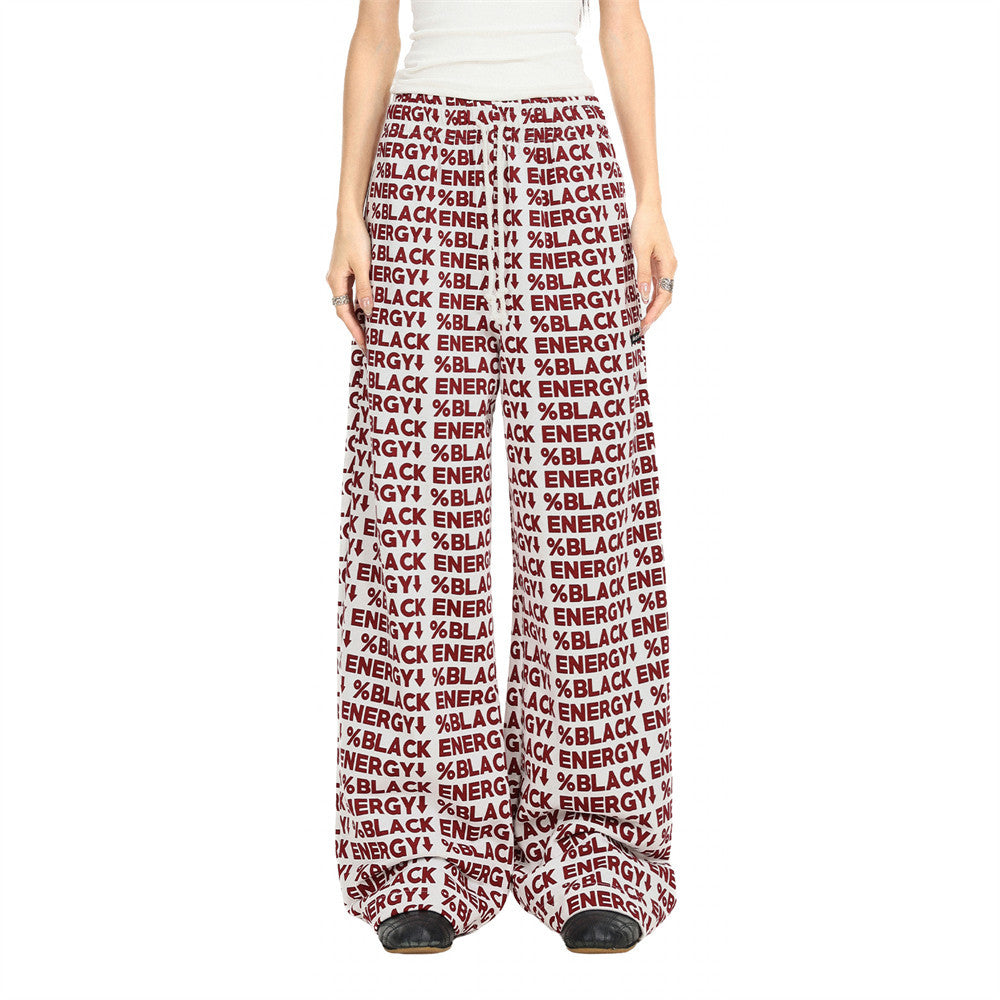 White wide-leg sweatpants with red BLACK ENERGY print, worn front view on model