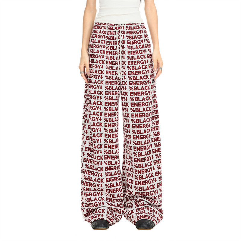 White wide-leg sweatpants with red BLACK ENERGY print, worn front view on model