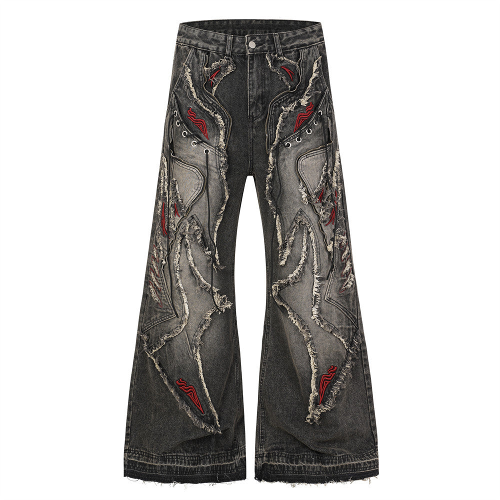 Men's baggy wide leg dark grey acid-washed flare jeans with raw-edge patchwork appliqué, red flame embroidery, and metal eyel