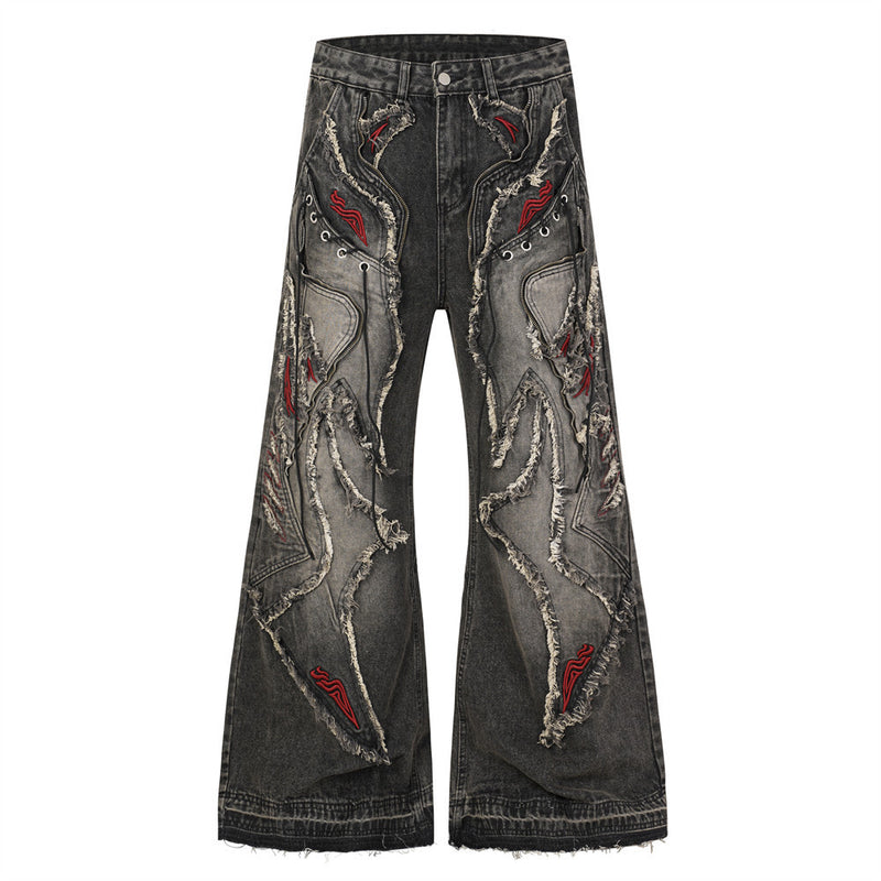 Men's baggy wide leg dark grey acid-washed flare jeans with raw-edge patchwork appliqué, red flame embroidery, and metal eyel