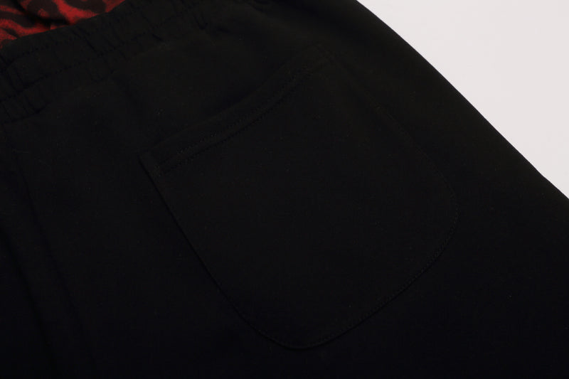 Wide-Leg-Jogginghose mit Leo-Print-Bund & seitlichen Nieten