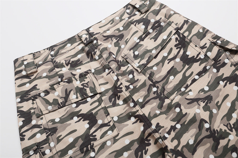 Back view of camo cargo shorts with flap cargo pockets and white polka dots