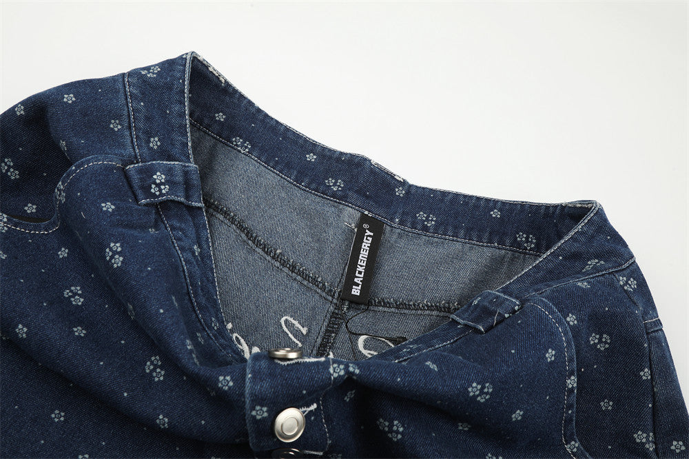 Inside waist view of dark blue floral print jeans with BLACKENERGY label