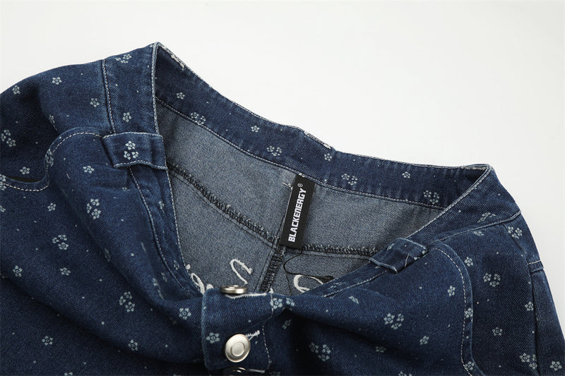Inside waist view of dark blue floral print jeans with BLACKENERGY label