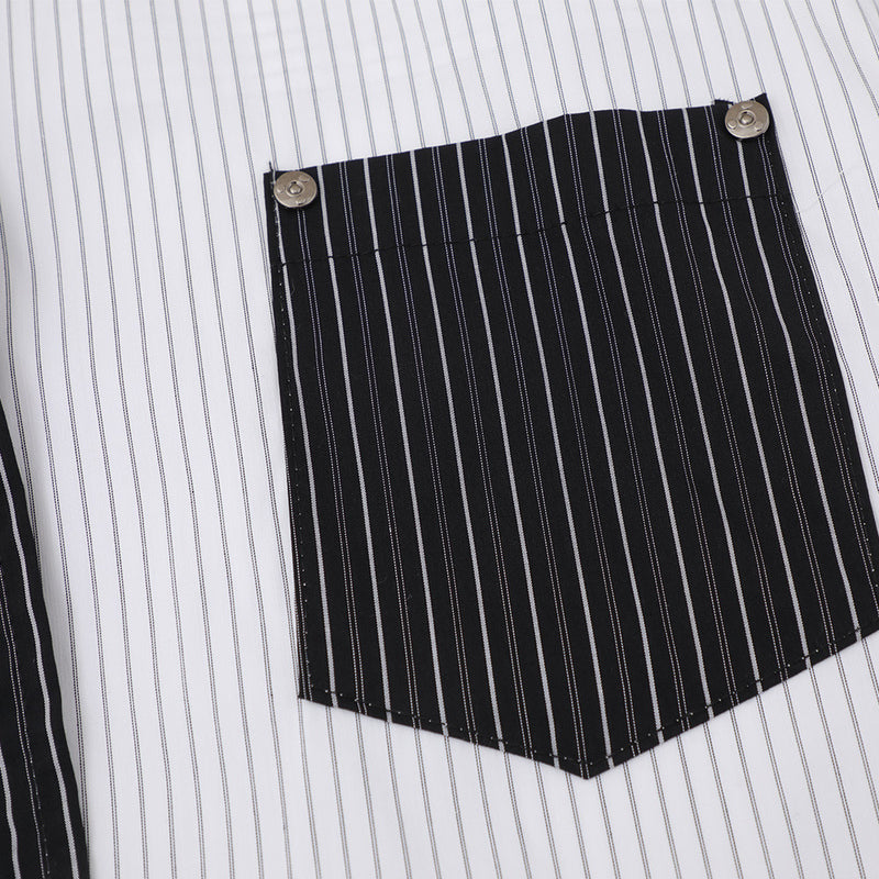 Black striped chest pocket with snap buttons on white shirt