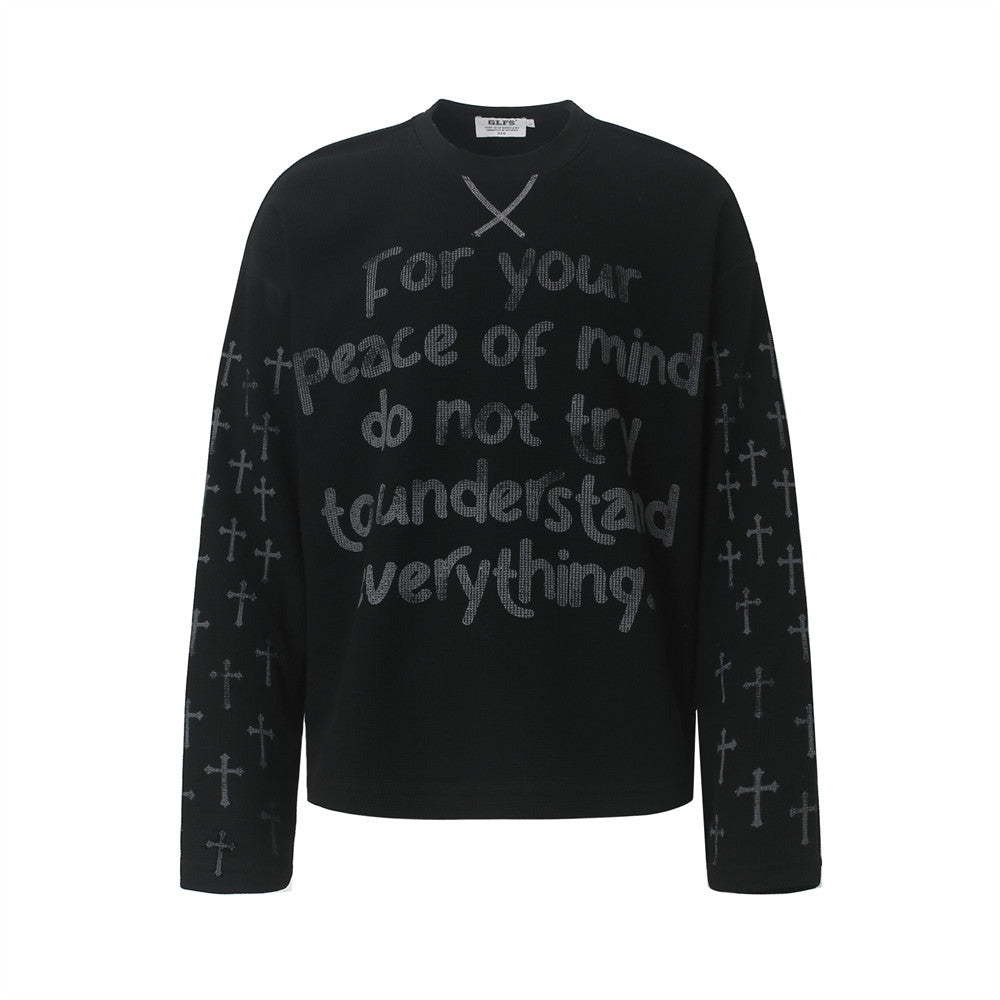 Oversized waffle-knit long-sleeve crew neck tee with cross print sleeves and chest lettering graphic in black