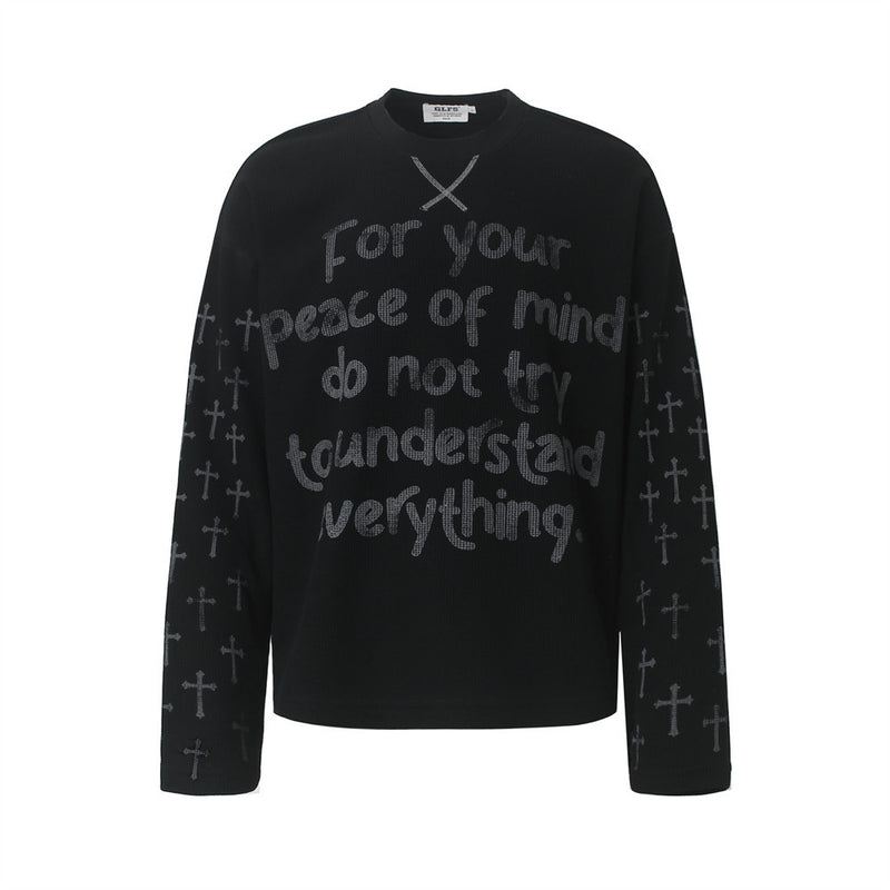 Oversized waffle-knit long-sleeve crew neck tee with cross print sleeves and chest lettering graphic in black