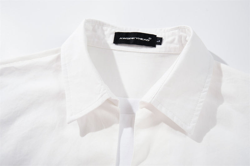 White shirt collar and faux layered neckline close-up