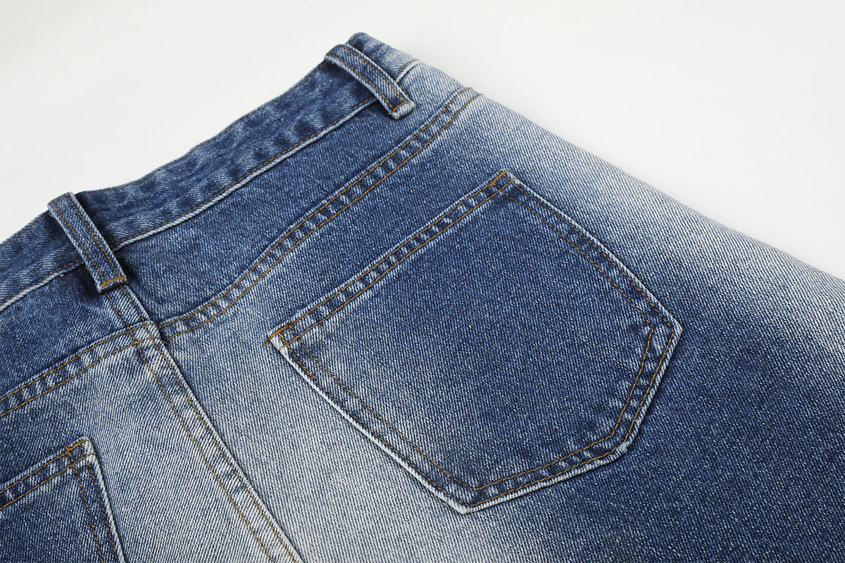 Vaqueros baggy de pierna ancha con cinturilla cruzada de broches y bolsillos bordados