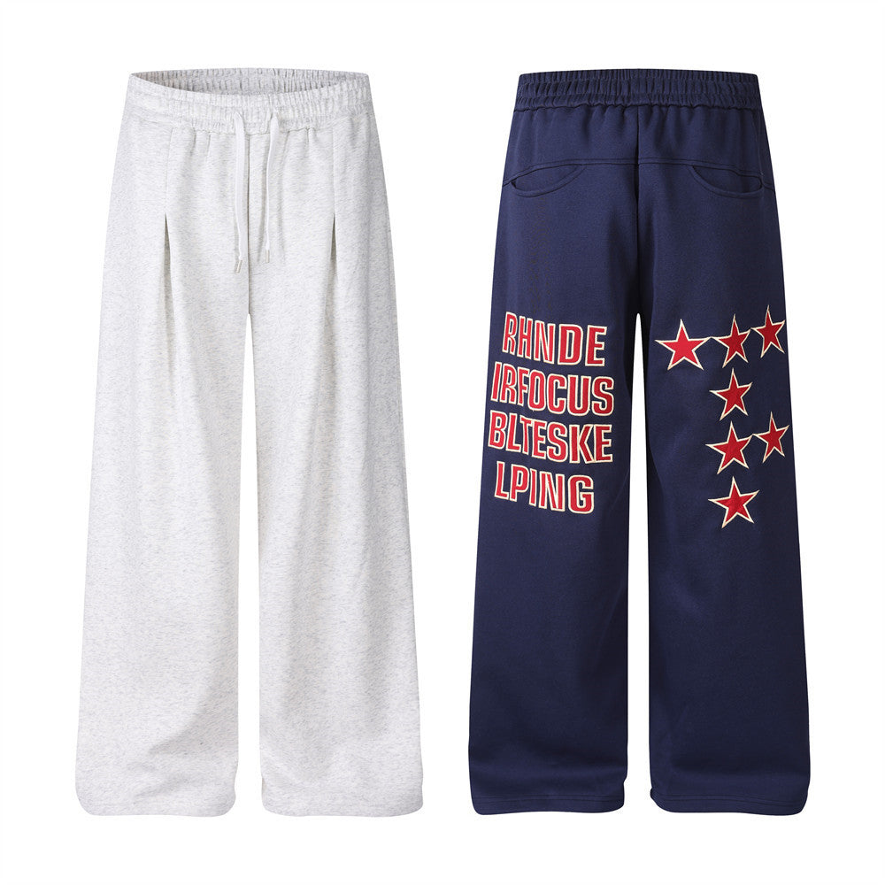 Pantalon de survêtement homme coupe wide leg – Étoiles, lettrage et cordon plissé