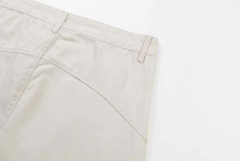Cream cargo pants back waistband corner and curved seam detail