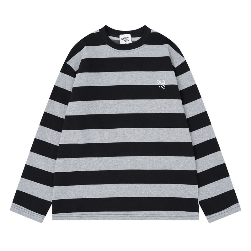 Front view of black and gray striped oversized crew neck long sleeve shirt with small chest logo