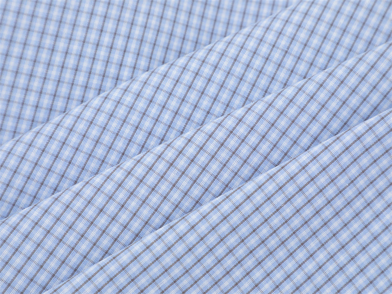 Close-up of the light blue plaid fabric texture and fine check pattern