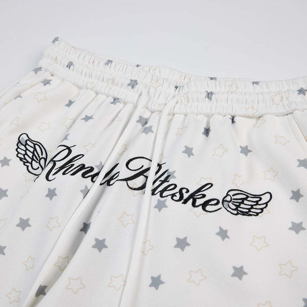 Pantalon de survêtement à jambes larges, imprimé étoiles, avec ailes d’ange et broderie de lettres