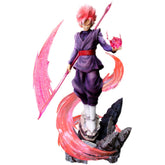 The Seakoff Goku Black Collectible Figure from Dragon Ball Super stands 38cm tall, featuring pink hair and wearing a purple outfit with white boots. It includes a rocky base, glowing energy sword, pink orb, and swirling energy effects for an action-packed scene.