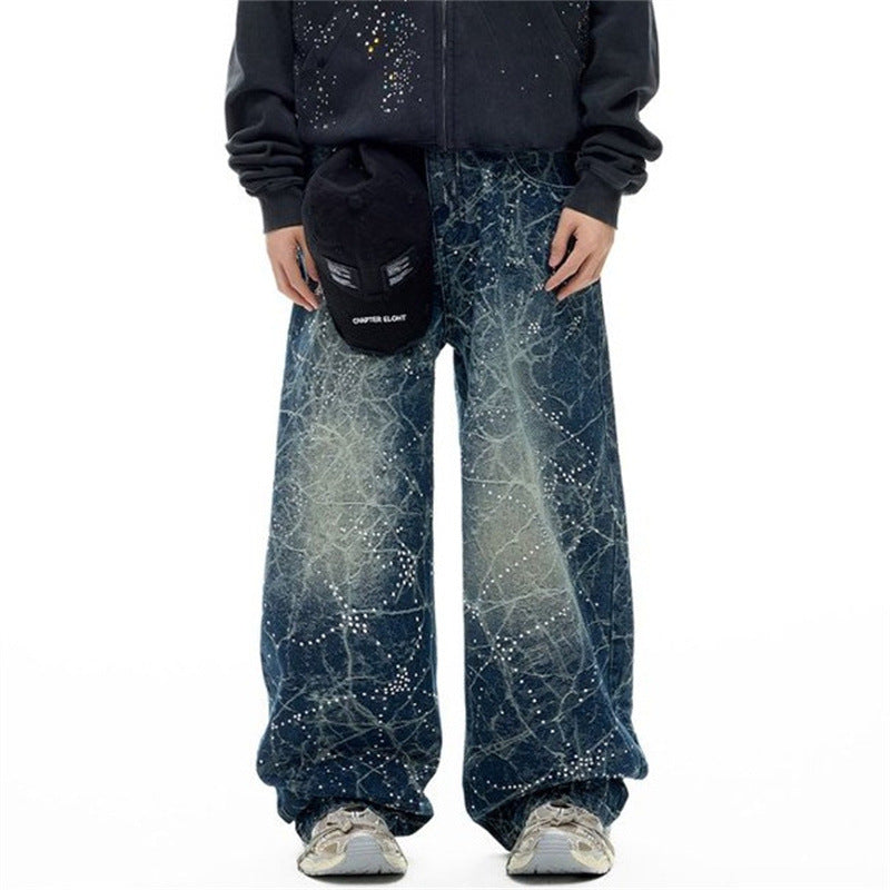 Front view of wide-leg blue distressed jeans with rhinestone constellation print