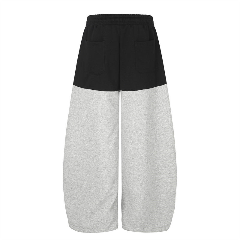 Pantalones de Chándal de Pierna Ancha con Bloques de Color y Detalles Gráficos de Tachuelas Plateadas