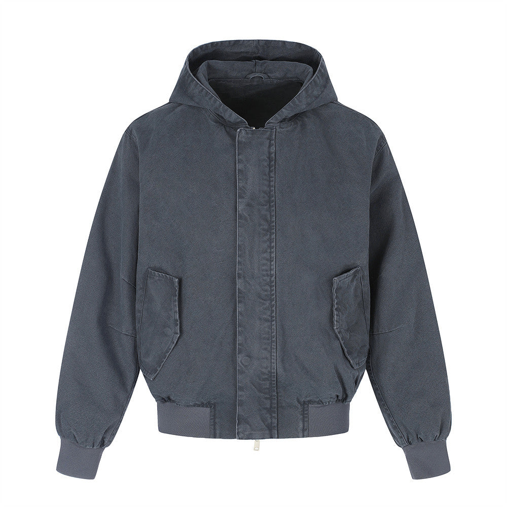 Oversized vintage washed hooded bomber jacket in navy, front view showing flap pockets and ribbed cuffs