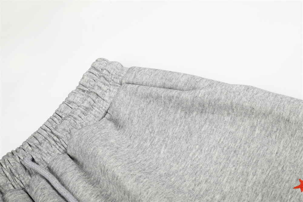 Close-up of gray sweatpants waistband seam and elastic stretch detail