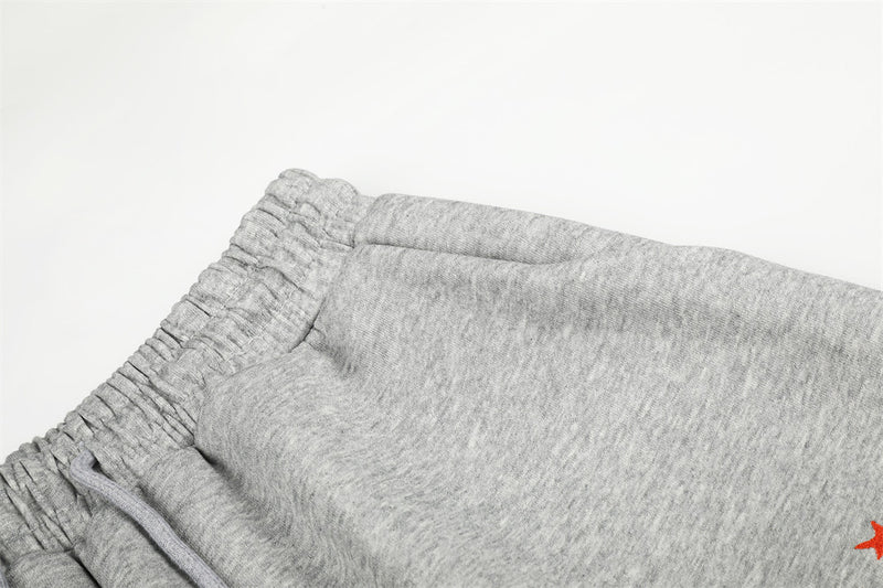 Close-up of gray sweatpants waistband seam and elastic stretch detail