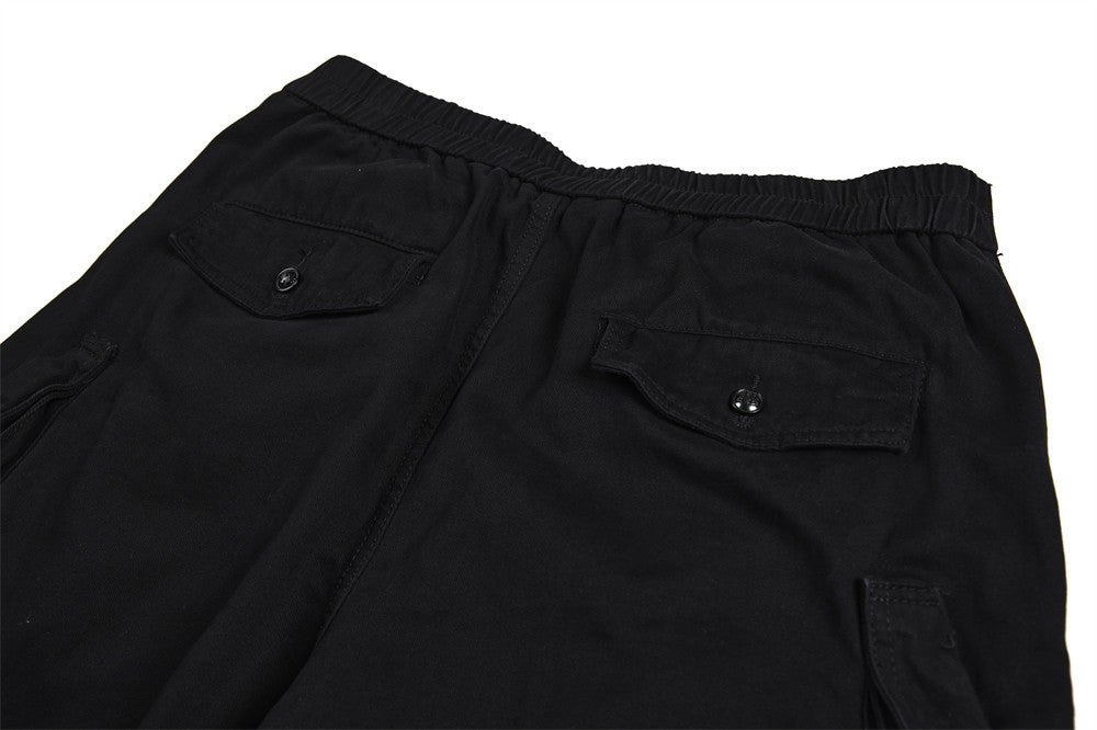 Pantalon cargo homme noir wide leg avec taille effet double boutonnage et multiples poches