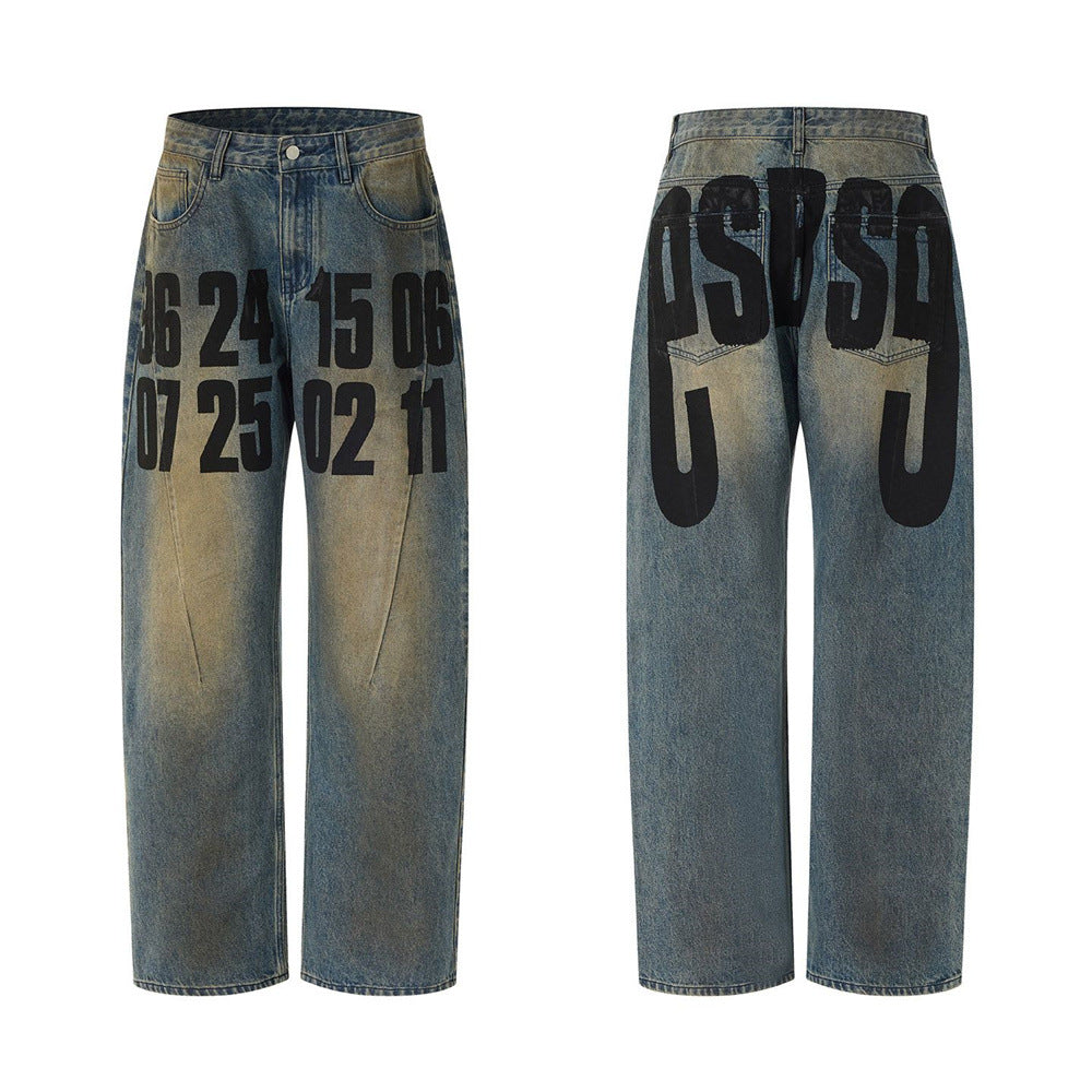 Men's baggy straight-leg jeans in vintage acid-wash blue with oversized black number print on front legs and letter graphic o
