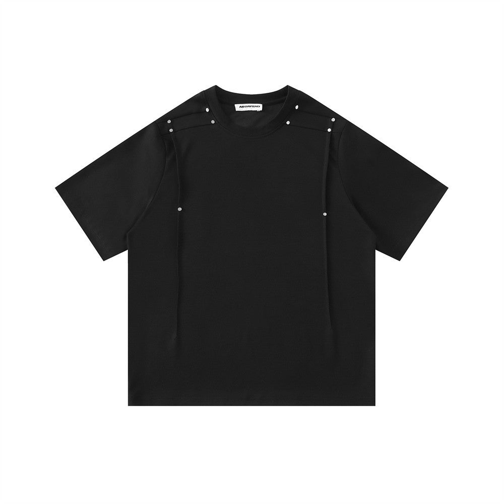 Oversized black and grey pinch-pleat t-shirt with silver stud shoulder detail, front view