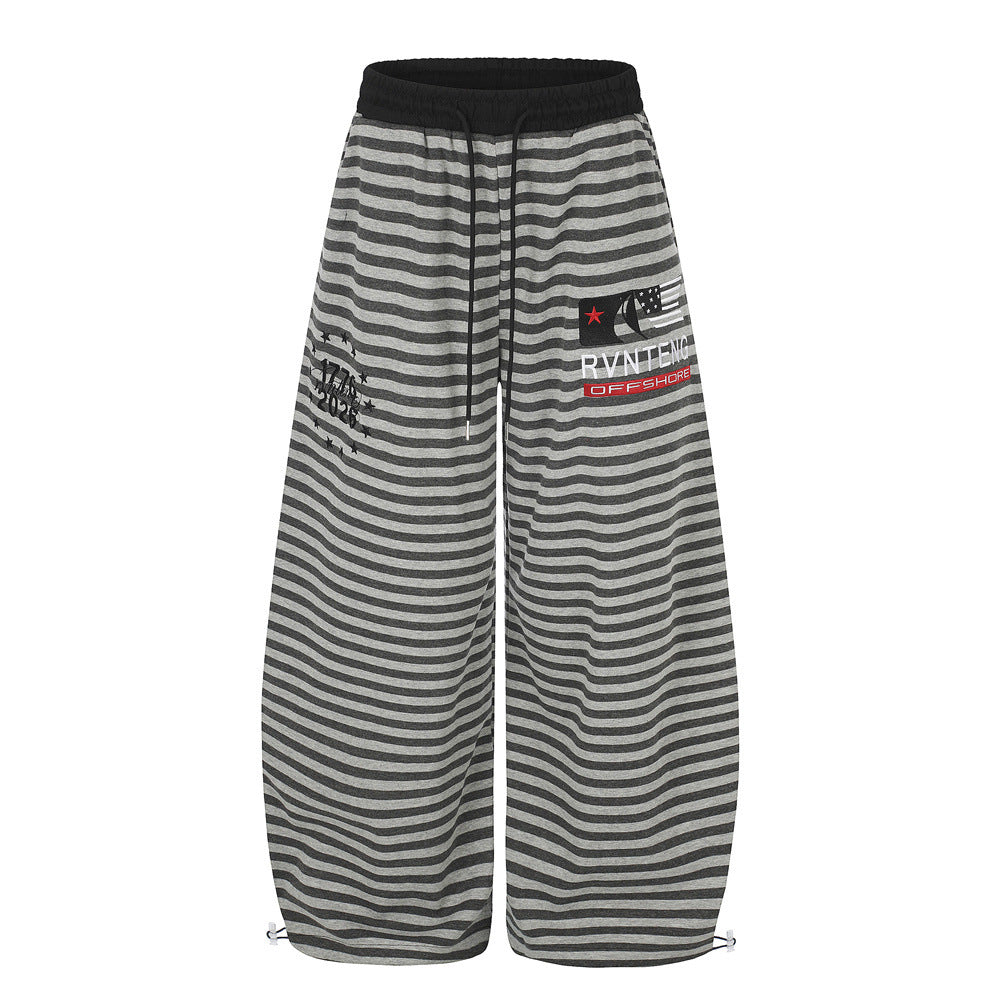 Men's wide-leg striped sweatpants with star and letter embroidery in grey and charcoal horizontal stripe, elasticated waistba