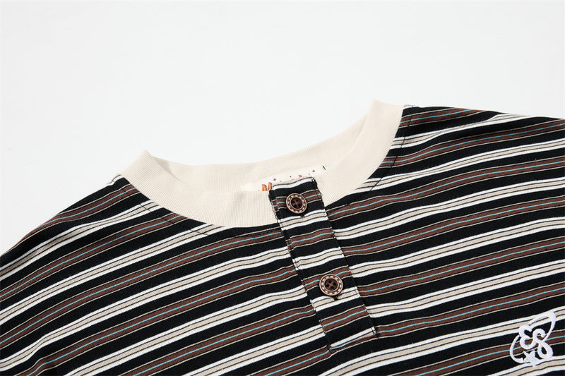 Close-up of striped Henley neckline with two-button placket and cream ribbed collar
