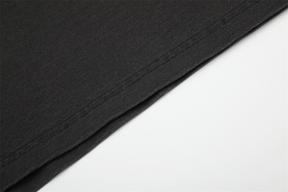 Close-up of black shirt hem with straight stitched edge