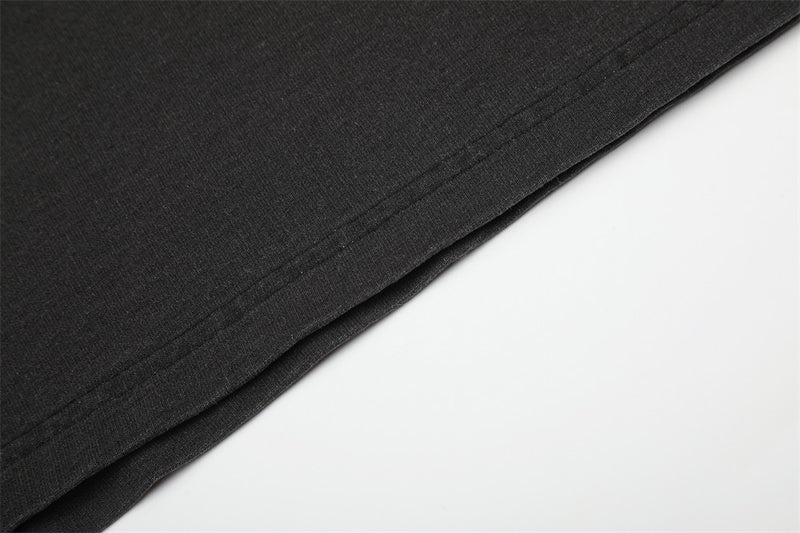 Close-up of black shirt hem with straight stitched edge