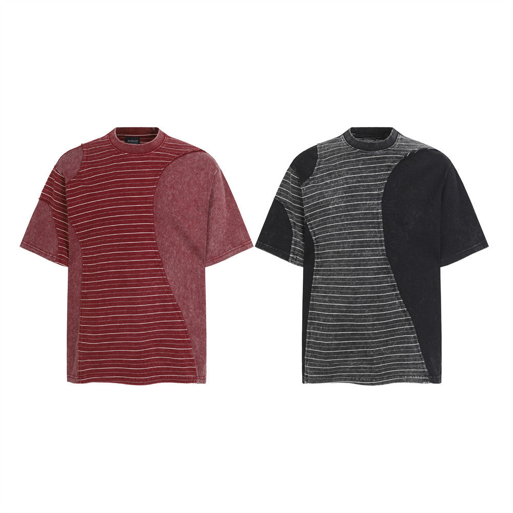Irregular patchwork stripe oversized acid wash t-shirt in washed burgundy red and charcoal black, front view