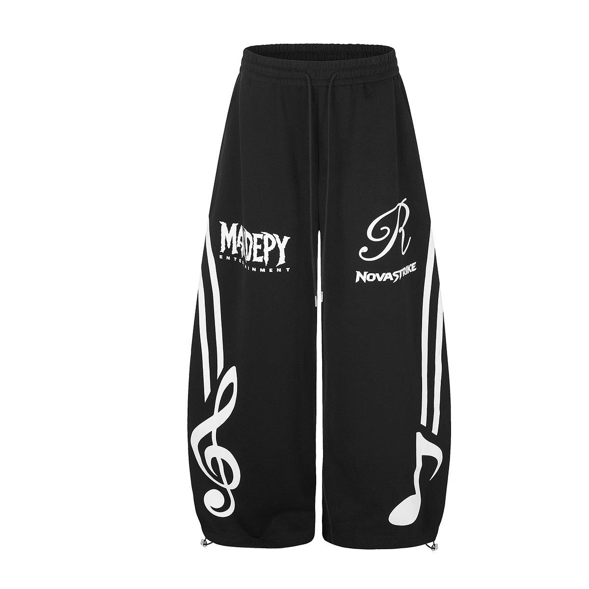 Pantalon de survêtement noir à jambes larges avec grands motifs de notes de musique et de clé de sol, et empiècements à rayures blanches